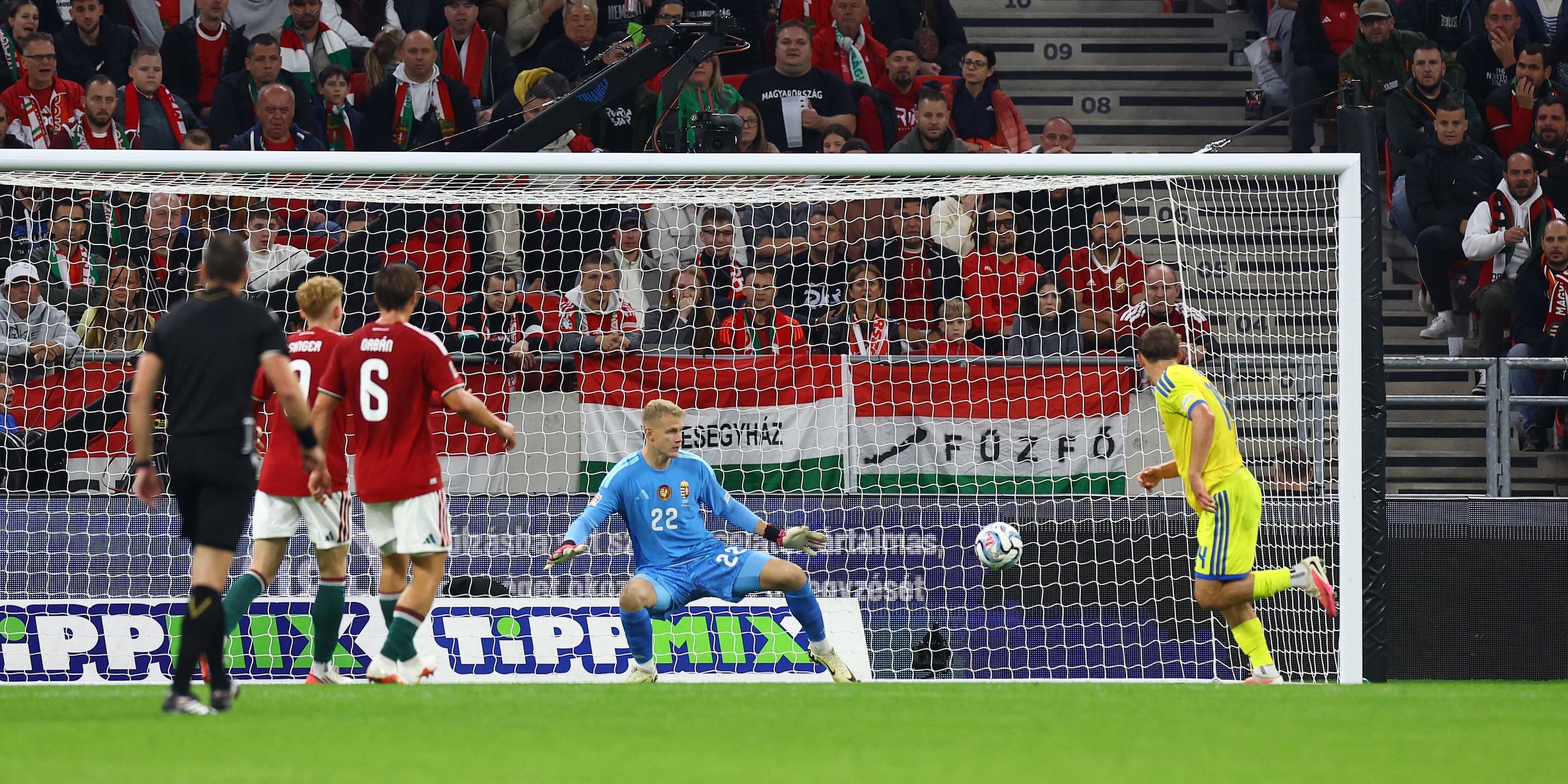 Ukraine's Danylo Sikan scores their first goal past Hungary's Balazs Toth